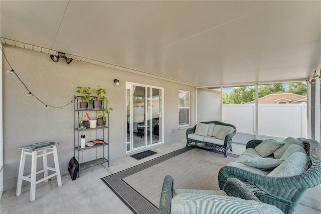 sunroom / solarium featuring an outdoor hangout area