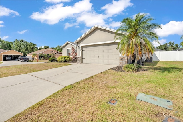 single story home with concrete driveway, stucco siding, and an attached garage