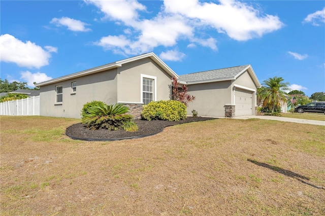 view of side of property featuring a garage, stucco siding, concrete driveway, and stone siding