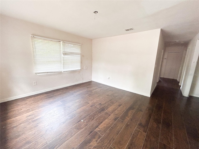 1160 Austin St, Bartow, FL 33830 - unfurnished room with dark wood-style floors and baseboards