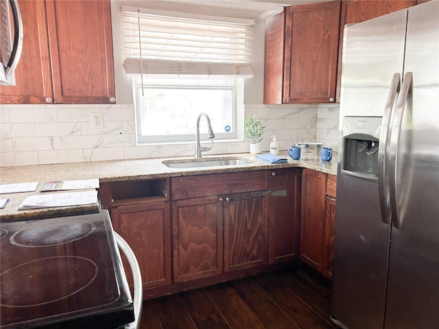 1160 Austin St, Bartow, FL 33830 - kitchen featuring stainless steel appliances, a sink, dark wood-type flooring, and light stone countertops