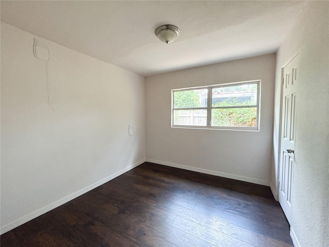 1160 Austin St, Bartow, FL 33830 - unfurnished room with dark wood-style floors and baseboards