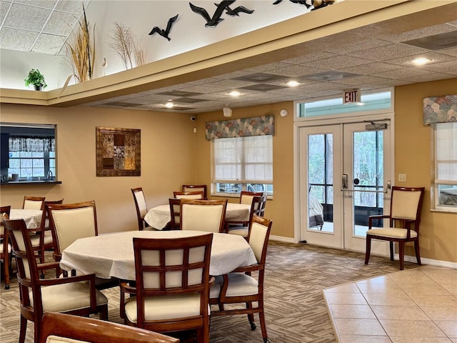 3798 N Chandler Dr, Hernando, FL 34442 - dining space with french doors, plenty of natural light, baseboards, and light carpet