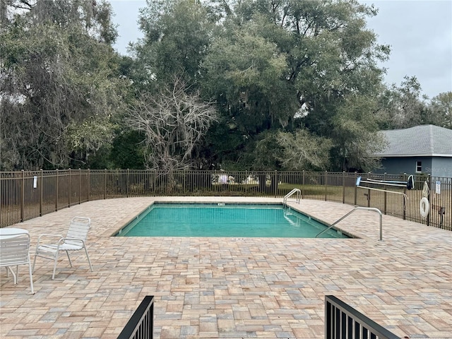 3798 N Chandler Dr, Hernando, FL 34442 - community pool with a patio and view of wooded area