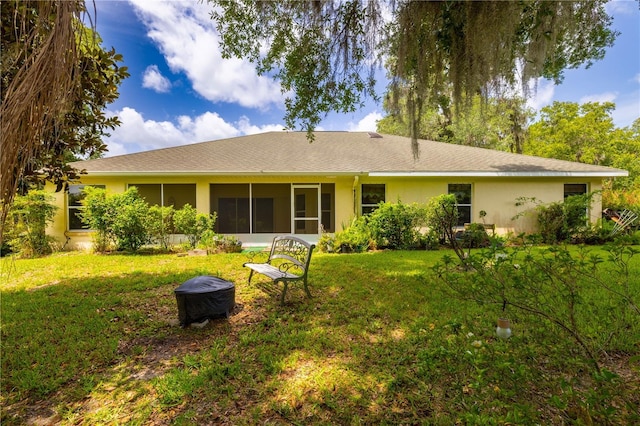3798 N Chandler Dr, Hernando, FL 34442 - rear view of house with stucco siding, a yard, and a sunroom