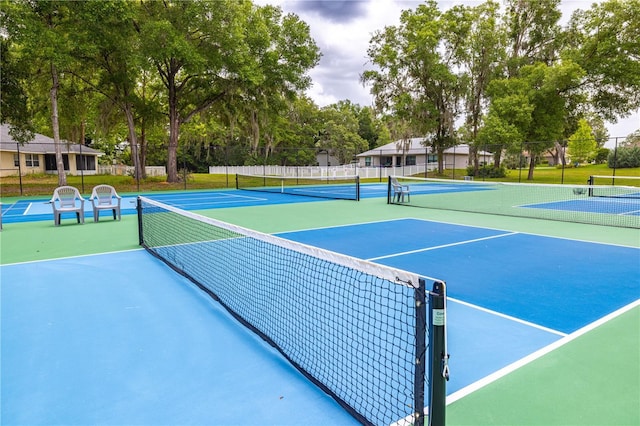 3798 N Chandler Dr, Hernando, FL 34442 - view of tennis court with view of wooded area