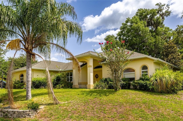 3798 N Chandler Dr, Hernando, FL 34442 - view of front facade with a front yard and stucco siding