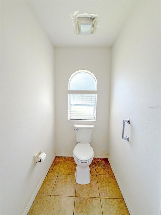 3798 N Chandler Dr, Hernando, FL 34442 - bathroom featuring toilet, tile patterned flooring, and baseboards