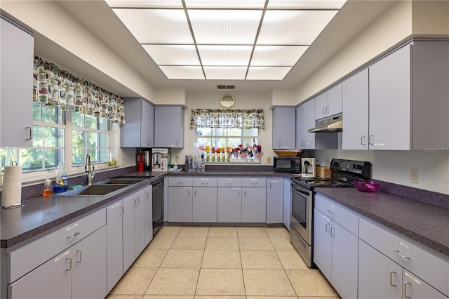 3798 N Chandler Dr, Hernando, FL 34442 - kitchen featuring black appliances, under cabinet range hood, a sink, and dark countertops