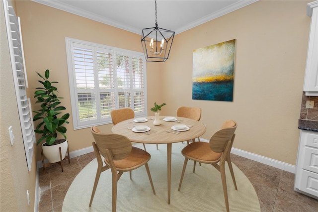 dining space featuring ornamental molding, tile patterned floors, a chandelier, and baseboards