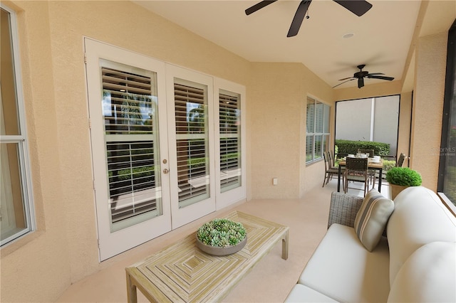 view of patio / terrace with a ceiling fan, french doors, and outdoor dining area
