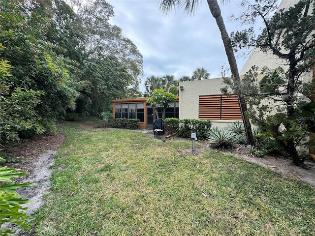 135 Wild Palm Dr, Bradenton, FL 34210 - view of grassy yard with a sunroom