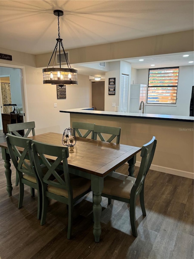 135 Wild Palm Dr, Bradenton, FL 34210 - dining space with dark wood finished floors, baseboards, and recessed lighting