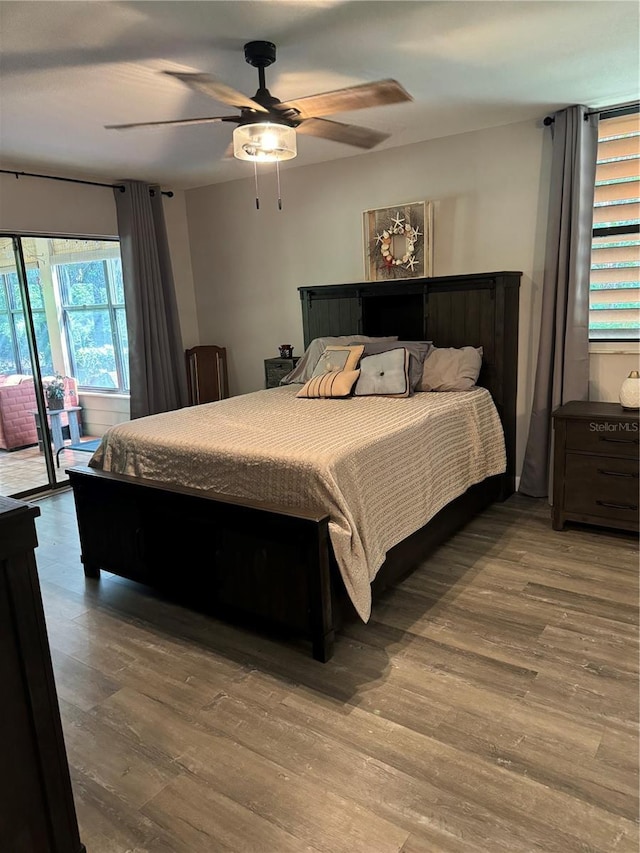 135 Wild Palm Dr, Bradenton, FL 34210 - bedroom featuring access to outside, wood finished floors, and ceiling fan