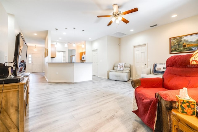 3281 Enclave Blvd, Mulberry, FL 33860 - living room featuring light wood-style floors, ceiling fan, recessed lighting, and baseboards