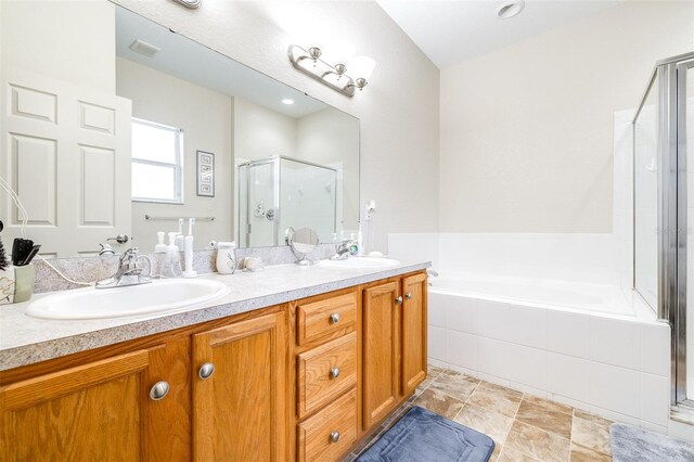 3281 Enclave Blvd, Mulberry, FL 33860 - bathroom featuring a stall shower, double vanity, and a garden tub
