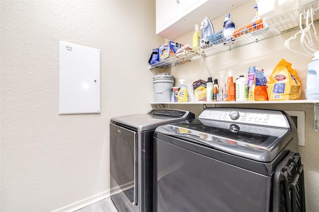 3281 Enclave Blvd, Mulberry, FL 33860 - laundry room featuring washer and dryer, cabinet space, a textured wall, baseboards, and wood finished floors
