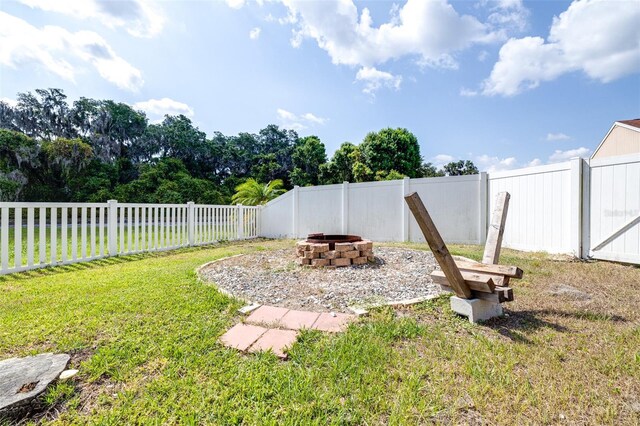 3281 Enclave Blvd, Mulberry, FL 33860 - view of yard featuring an outdoor fire pit