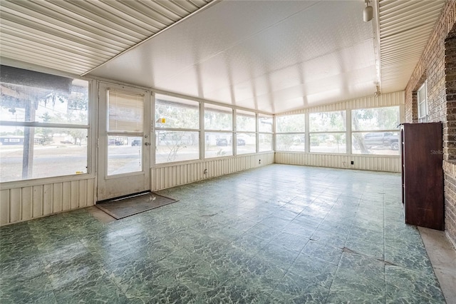 unfurnished sunroom with vaulted ceiling