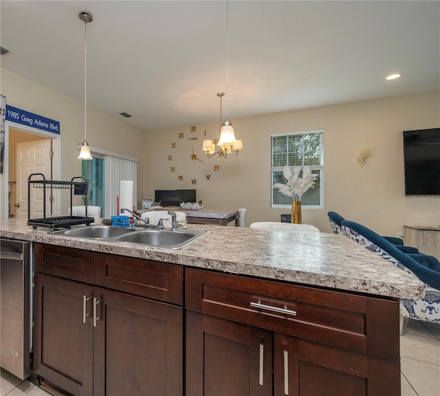 1105 Watersedge Dr, Lakeland, FL 33801 - kitchen with open floor plan, a sink, light tile patterned flooring, light countertops, and recessed lighting