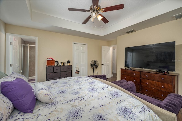 1105 Watersedge Dr, Lakeland, FL 33801 - bedroom featuring a tray ceiling, a closet, and ceiling fan