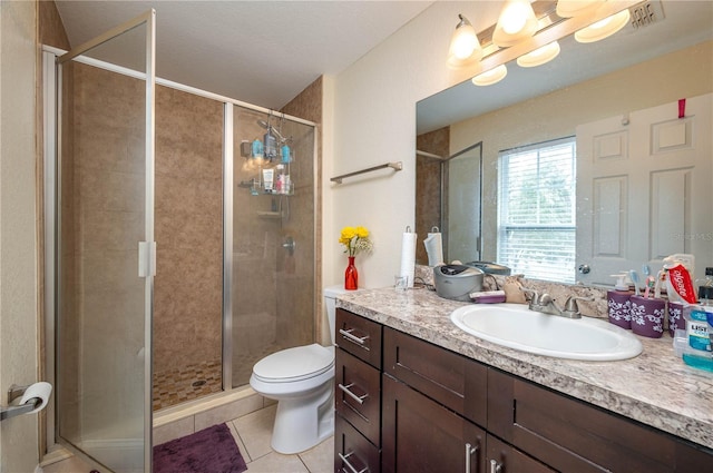 1105 Watersedge Dr, Lakeland, FL 33801 - full bathroom with tile patterned floors, a shower stall, vanity, and toilet