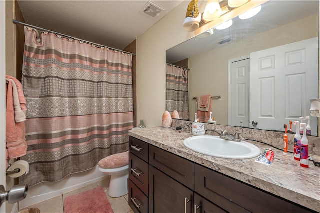 1105 Watersedge Dr, Lakeland, FL 33801 - full bath with tile patterned flooring, vanity, toilet, and shower / tub combo