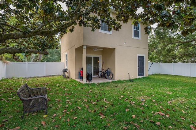 1105 Watersedge Dr, Lakeland, FL 33801 - rear view of property featuring stucco siding, a ceiling fan, and a patio