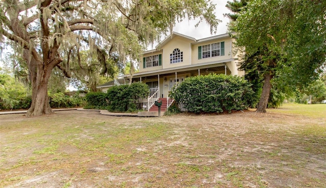 330 W Palmetto St, Lakeland, FL 33815 - view of front of home featuring a front yard and covered porch