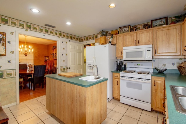 330 W Palmetto St, Lakeland, FL 33815 - kitchen featuring white appliances, a chandelier, light tile patterned floors, a kitchen island with sink, and wallpapered walls