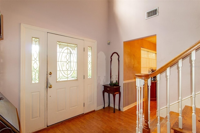 330 W Palmetto St, Lakeland, FL 33815 - foyer featuring wood finished floors, a high ceiling, and stairs