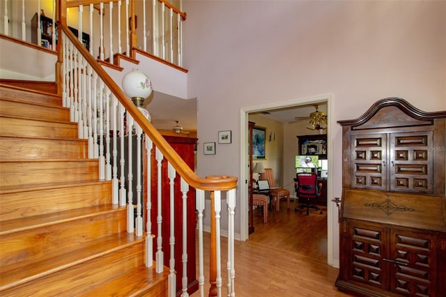 330 W Palmetto St, Lakeland, FL 33815 - stairway with wood finished floors, a towering ceiling, and baseboards