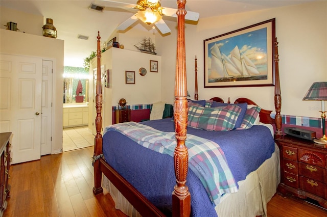 330 W Palmetto St, Lakeland, FL 33815 - bedroom with wood finished floors, ensuite bath, and a ceiling fan