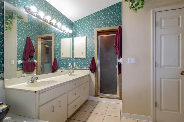 330 W Palmetto St, Lakeland, FL 33815 - bathroom with wallpapered walls, a stall shower, tile patterned floors, vaulted ceiling, and double vanity