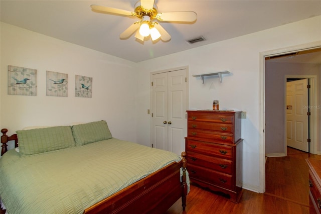 330 W Palmetto St, Lakeland, FL 33815 - bedroom with dark wood finished floors, a closet, a ceiling fan, and baseboards