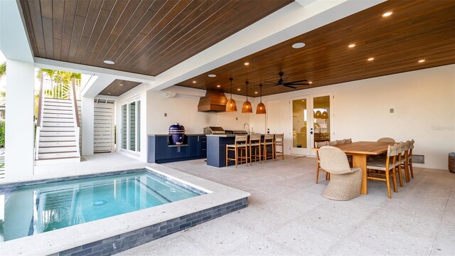 531 68th St, Holmes Beach, FL 34217 - view of pool with french doors, stairway, a patio area, exterior kitchen, and a ceiling fan