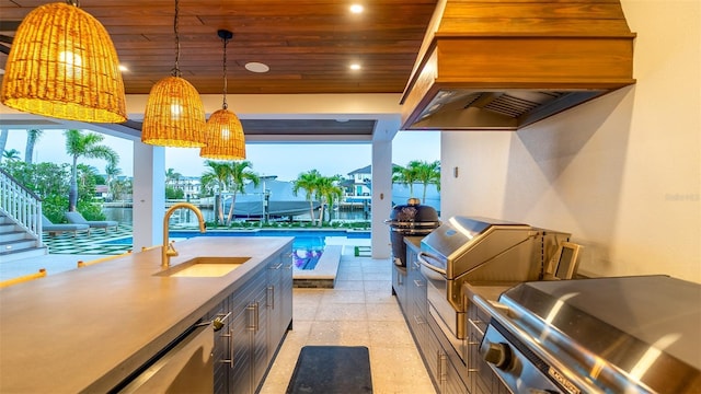 531 68th St, Holmes Beach, FL 34217 - kitchen featuring a sink, wood ceiling, recessed lighting, hanging light fixtures, and premium range hood