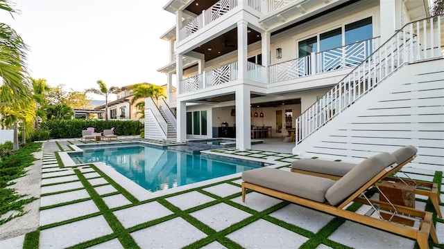 531 68th St, Holmes Beach, FL 34217 - view of swimming pool with stairway, a patio area, a pool with connected hot tub, and an outdoor living space