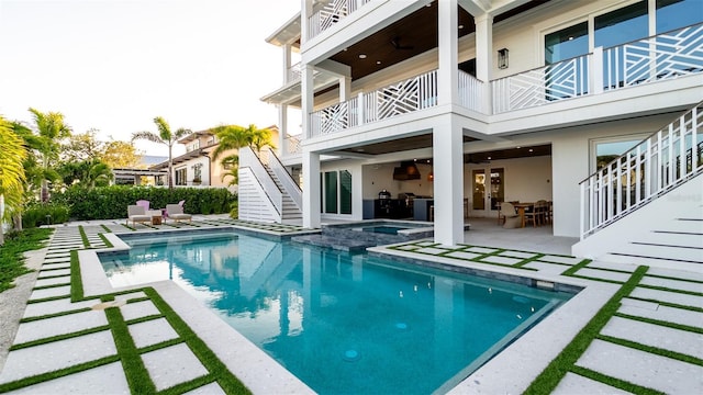 531 68th St, Holmes Beach, FL 34217 - view of swimming pool featuring stairway, a patio area, and a pool with connected hot tub