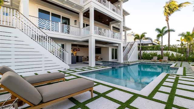 531 68th St, Holmes Beach, FL 34217 - view of pool featuring stairs, a patio area, an outdoor living space, a pool with connected hot tub, and fence