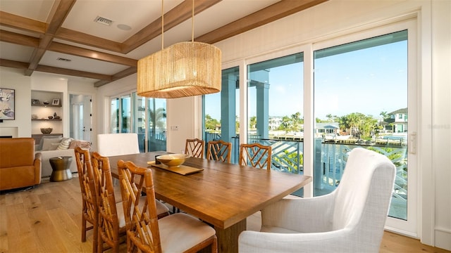 531 68th St, Holmes Beach, FL 34217 - dining room featuring light wood-style floors, beam ceiling, and coffered ceiling