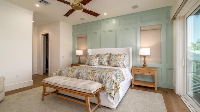 531 68th St, Holmes Beach, FL 34217 - bedroom with a decorative wall, light wood finished floors, ceiling fan, access to exterior, and recessed lighting