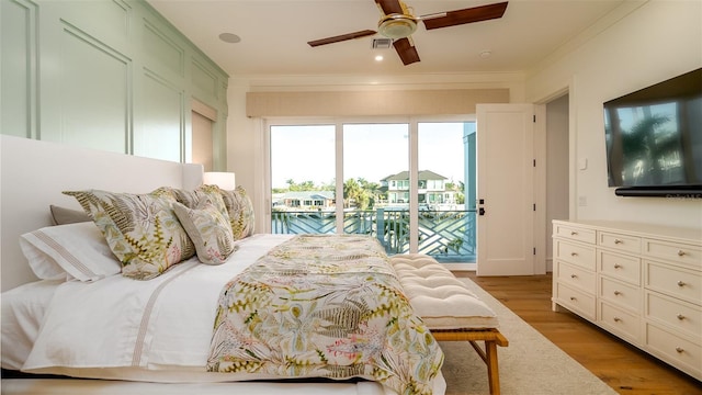 531 68th St, Holmes Beach, FL 34217 - bedroom featuring access to outside, ornamental molding, wood finished floors, and a ceiling fan