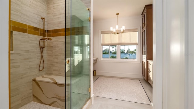 531 68th St, Holmes Beach, FL 34217 - full bathroom with a shower stall, a chandelier, and baseboards