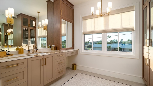531 68th St, Holmes Beach, FL 34217 - bathroom with a chandelier, plenty of natural light, and vanity