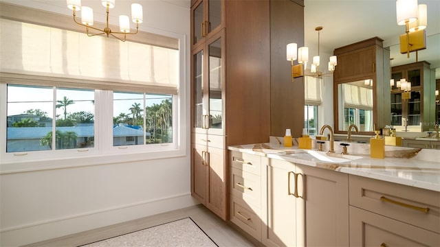 531 68th St, Holmes Beach, FL 34217 - bathroom with a chandelier, healthy amount of natural light, and vanity