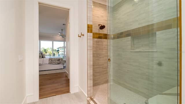 531 68th St, Holmes Beach, FL 34217 - bathroom with ensuite bathroom, a stall shower, baseboards, and ceiling fan