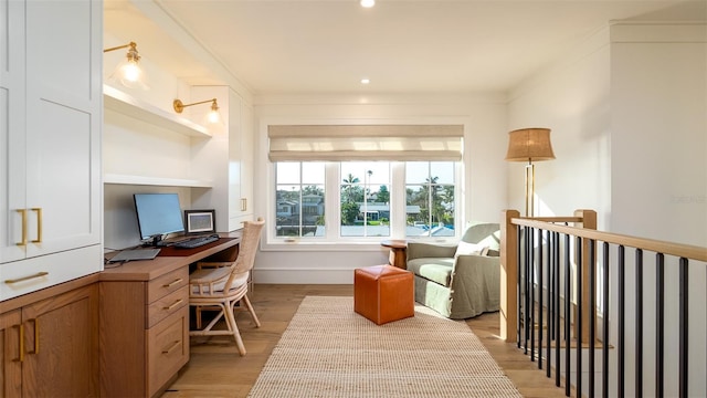 531 68th St, Holmes Beach, FL 34217 - home office with built in desk, light wood-style floors, and recessed lighting