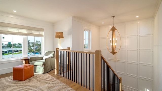 531 68th St, Holmes Beach, FL 34217 - sitting room with an upstairs landing, wood finished floors, and recessed lighting