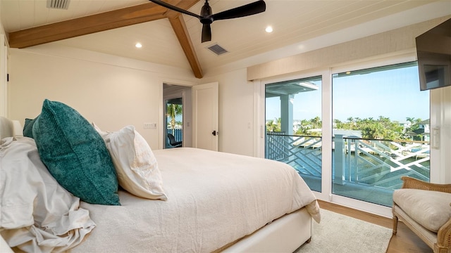 531 68th St, Holmes Beach, FL 34217 - bedroom with access to exterior, beamed ceiling, recessed lighting, multiple windows, and wood finished floors